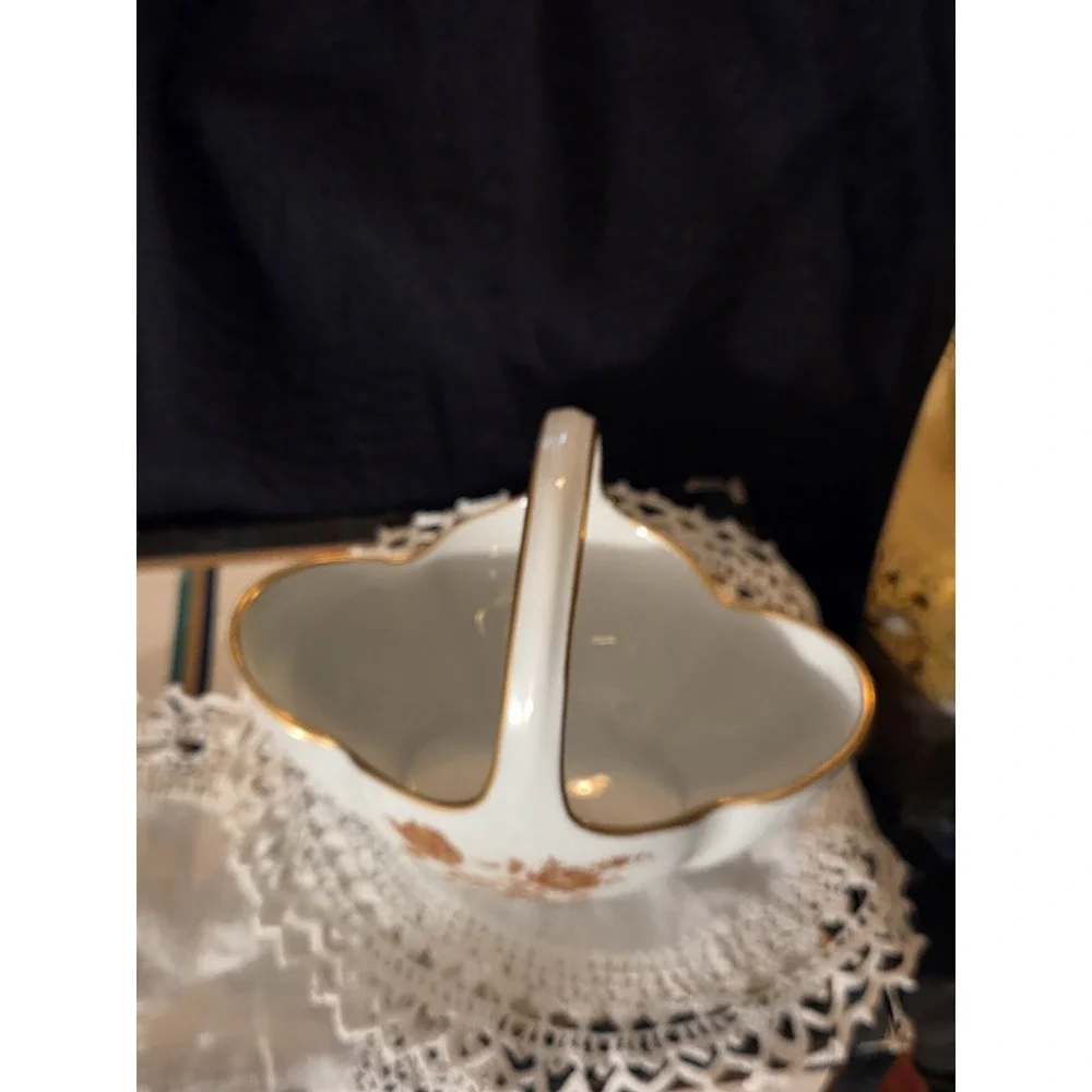 vintage Limoges, France, porcelain compote basket featuring a tall arched...